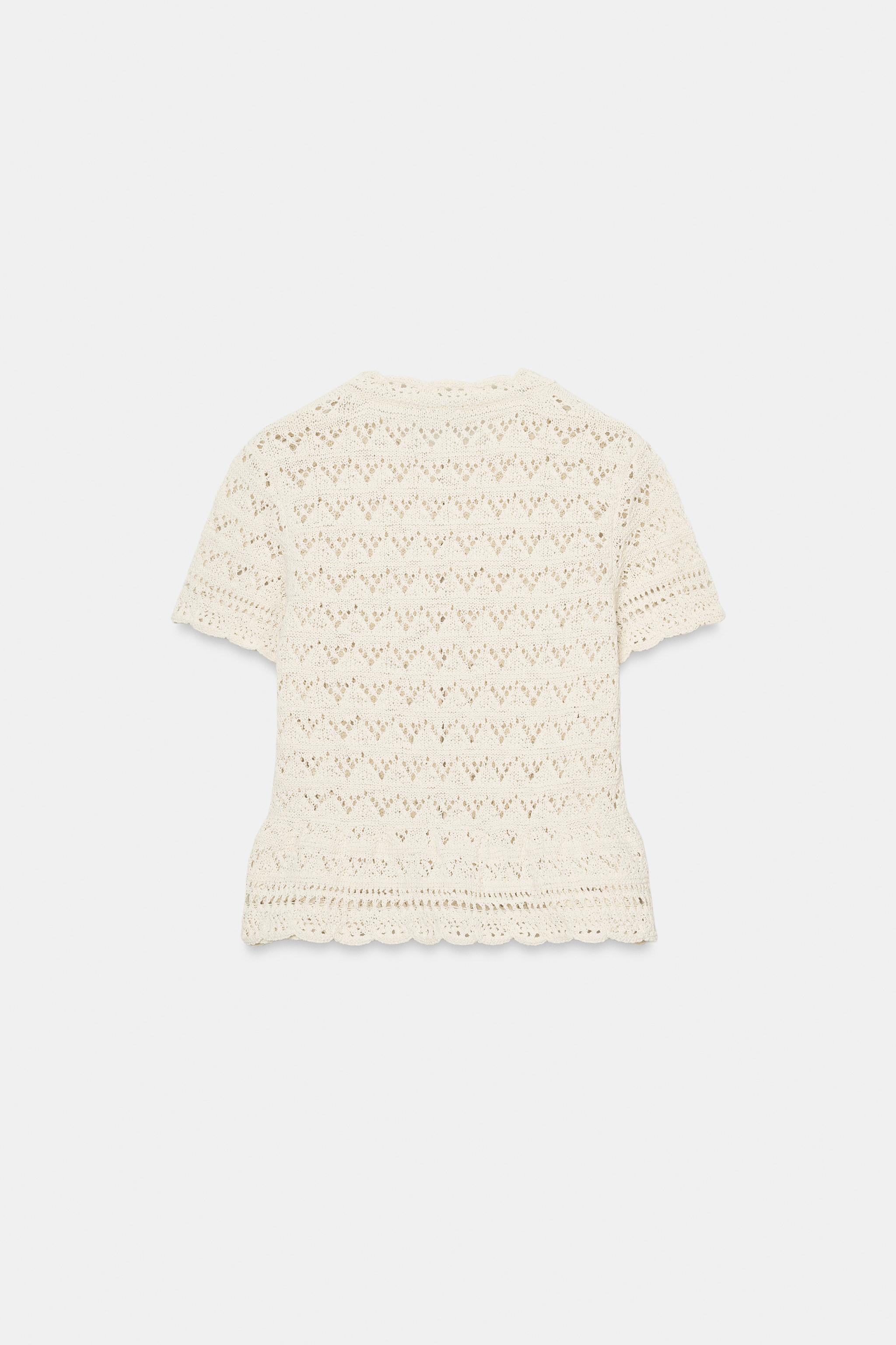 GILET EN MAILLE POINTELLE À MANCHES COURTES
